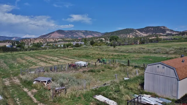 an aerial view of a house with outdoor space