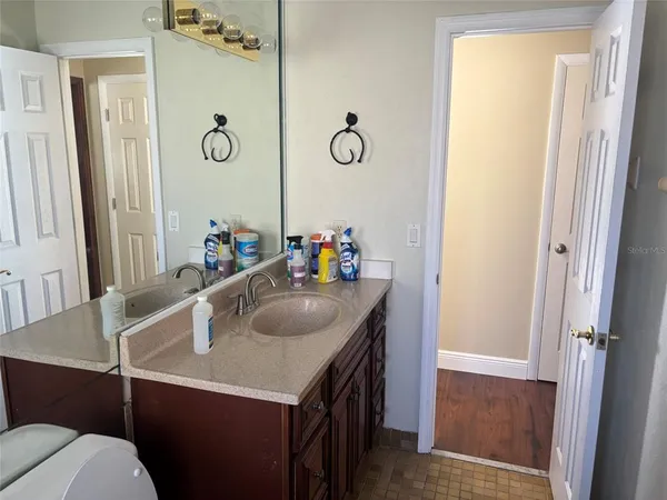 a bathroom with a sink and a mirror