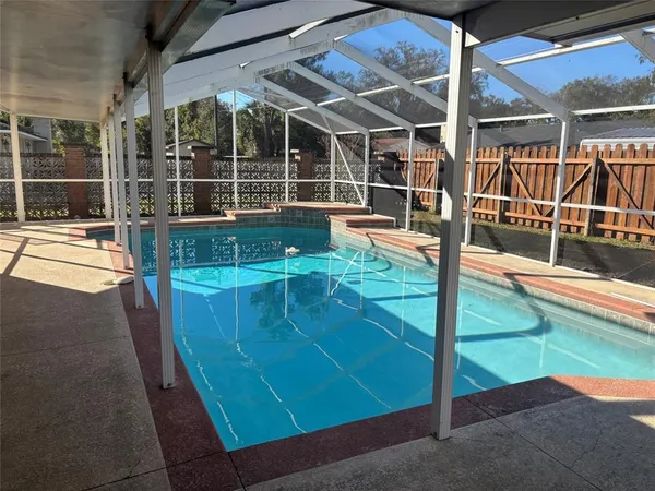 a view of a swimming pool with a porch