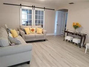 a living room with furniture and a window