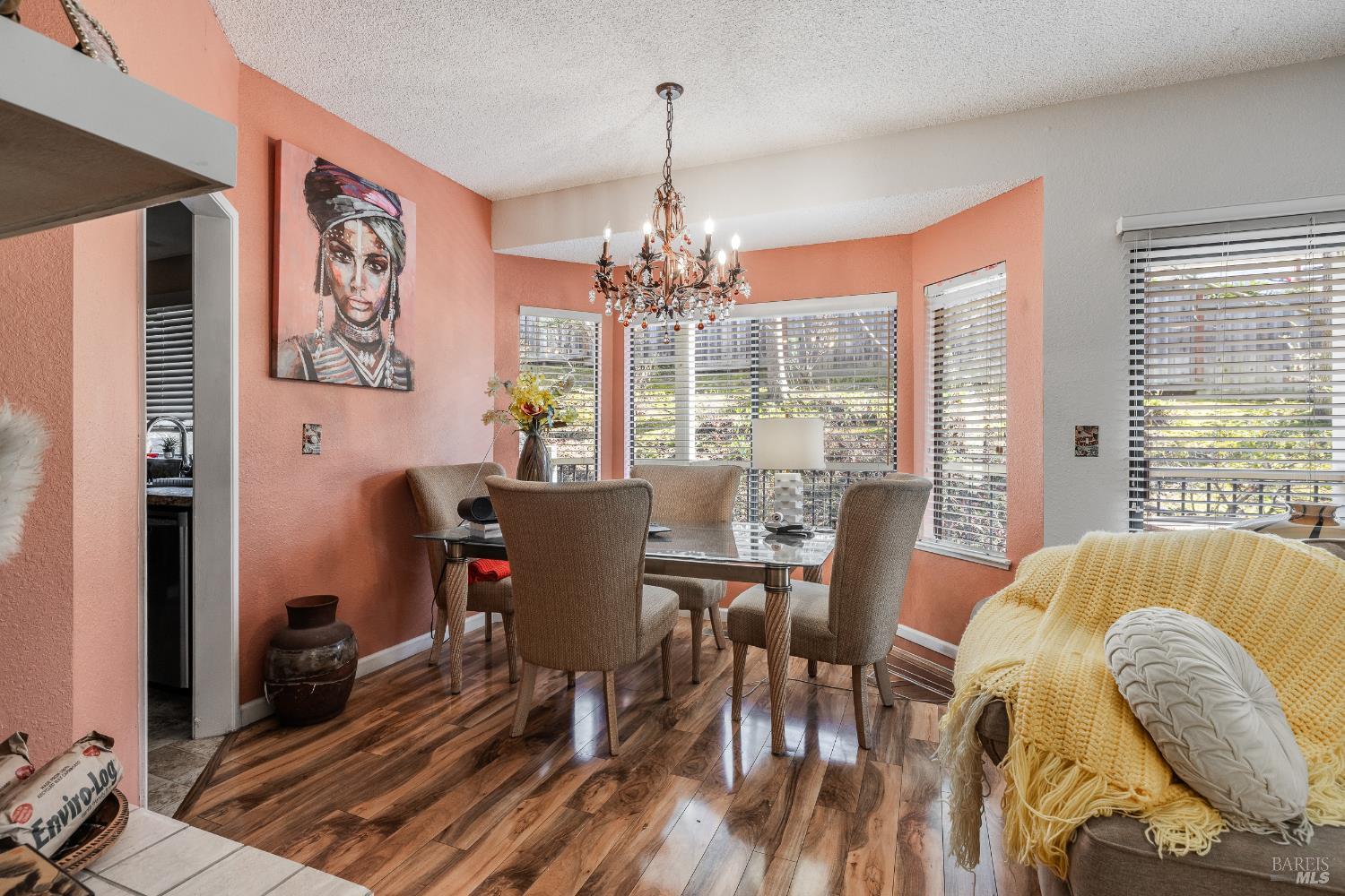 2454 Sebastopol Lane Hayward, CA 94542 - Photo 14 of 35 a dining room with furniture a chandelier and wooden floor