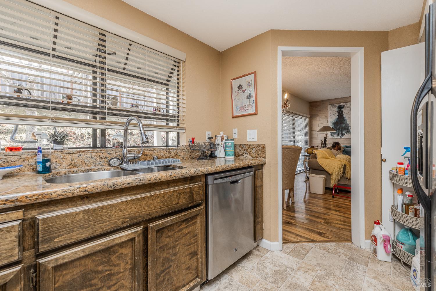 2454 Sebastopol Lane Hayward, CA 94542 - Photo 17 of 35 a kitchen with stainless steel appliances granite countertop a sink and cabinets