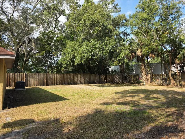 a swimming pool with wooden fence