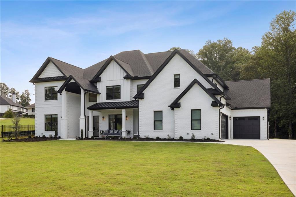 3459 Camp Branch Road Buford, GA 30519 - Photo 1 of 1 a front view of house with yard and swimming pool