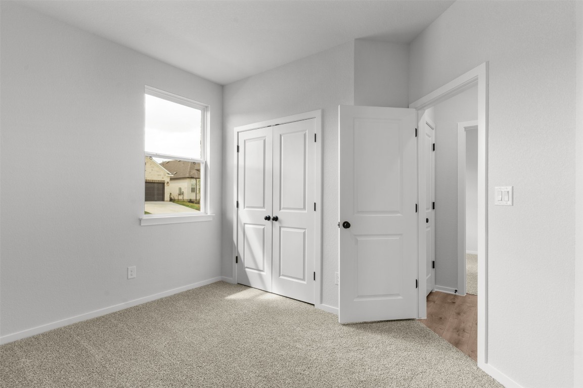 101 Coyote Willow Way Georgetown, TX 78633 - Photo 17 of 34 a view of an empty room with a window