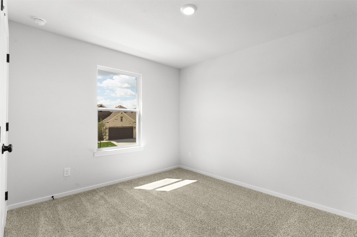 101 Coyote Willow Way Georgetown, TX 78633 - Photo 21 of 34 an empty room with a window