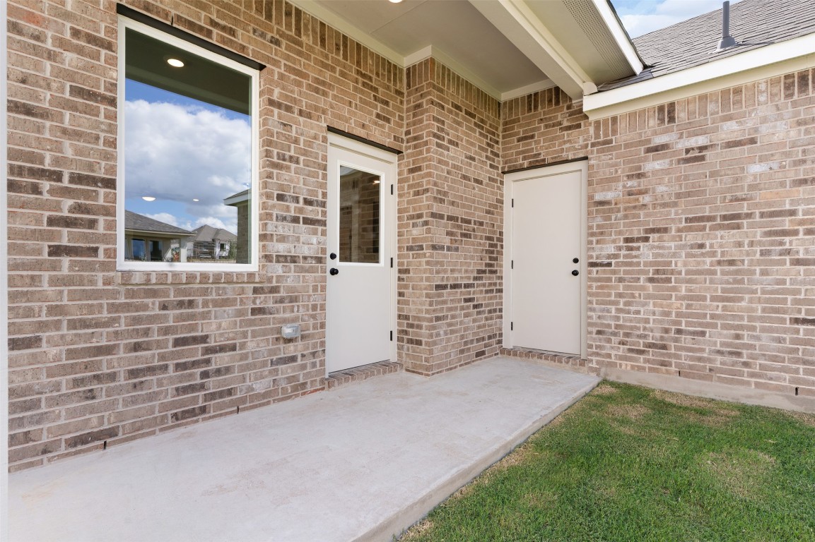 101 Coyote Willow Way Georgetown, TX 78633 - Photo 22 of 34 a view of a brick house with a door