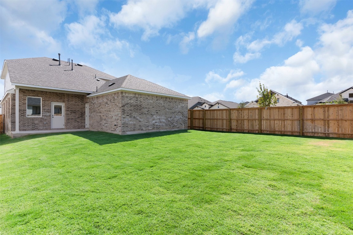 101 Coyote Willow Way Georgetown, TX 78633 - Photo 23 of 34 a view of a house with a yard
