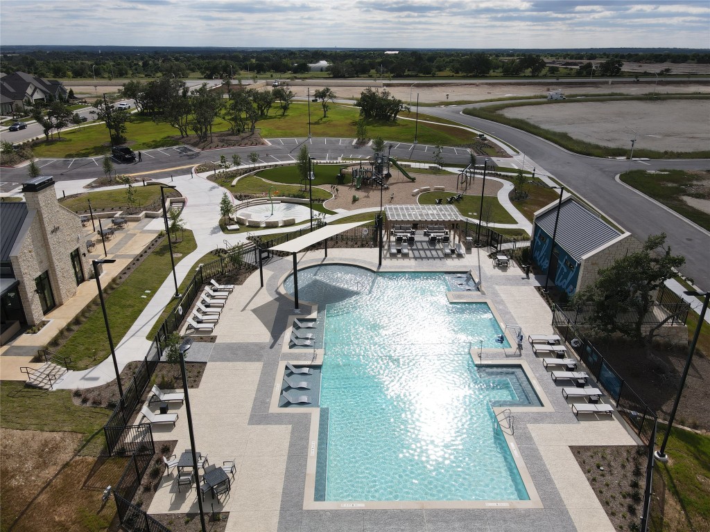 101 Coyote Willow Way Georgetown, TX 78633 - Photo 26 of 34 an aerial view of a swimming pool with outdoor seating