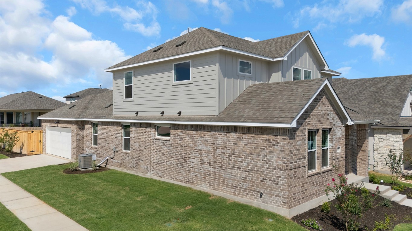 101 Coyote Willow Way Georgetown, TX 78633 - Photo 4 of 34 a front view of a house with a yard