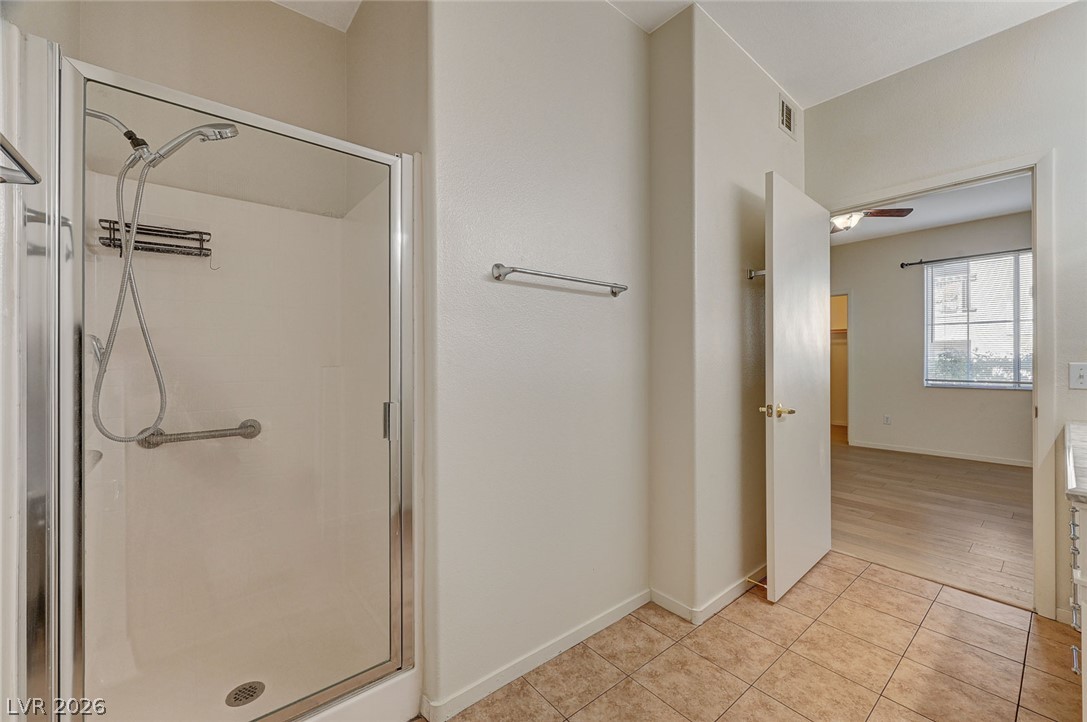 9050 West Warm Springs Road, Unit 1147 Las Vegas, NV 89148 - Photo 29 of 36 A pristine shower enclosure provides a clean and functional space within this bathroom.