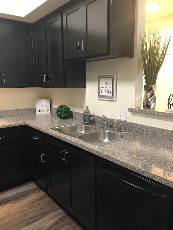 200 East 10th Street Gilroy, CA 95020 - Photo 11 of 14 a kitchen with granite countertop a sink a stove and cabinets