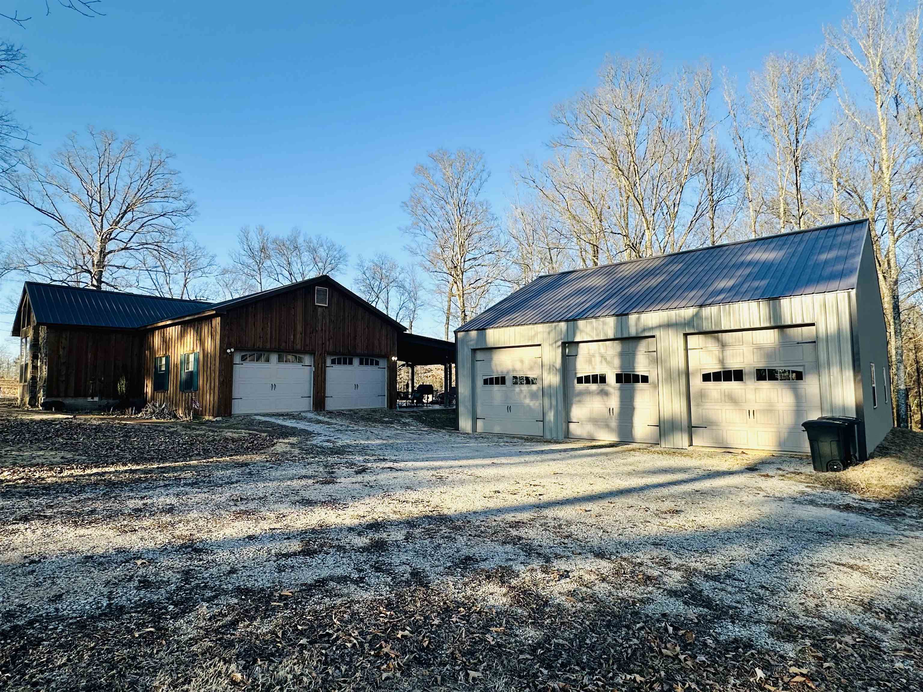 6230 New Hope Road Michie, TN 38357 - Photo 17 of 24 Exterior space featuring a garage and an outdoor structure