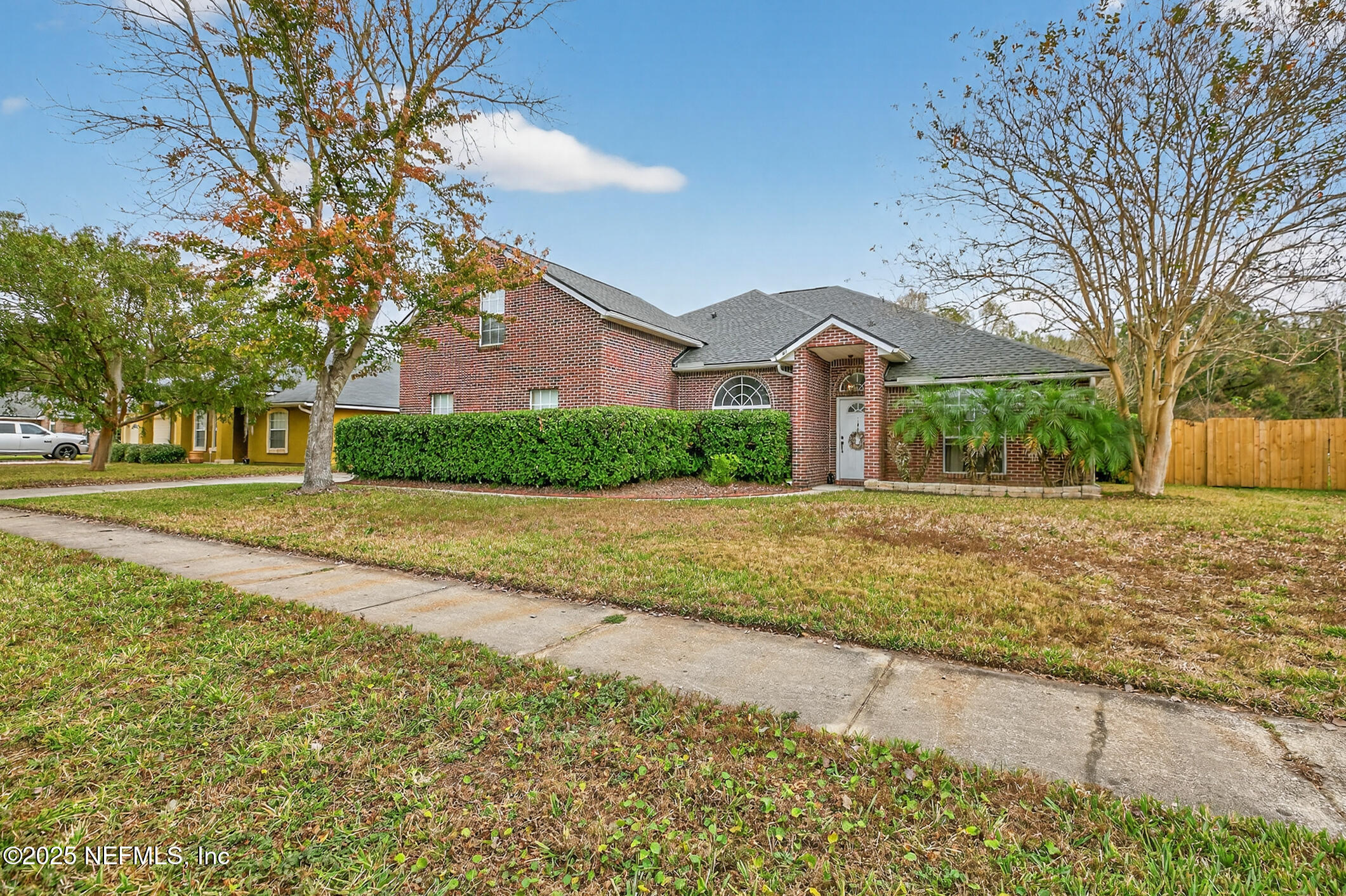 a front view of a house with a yard