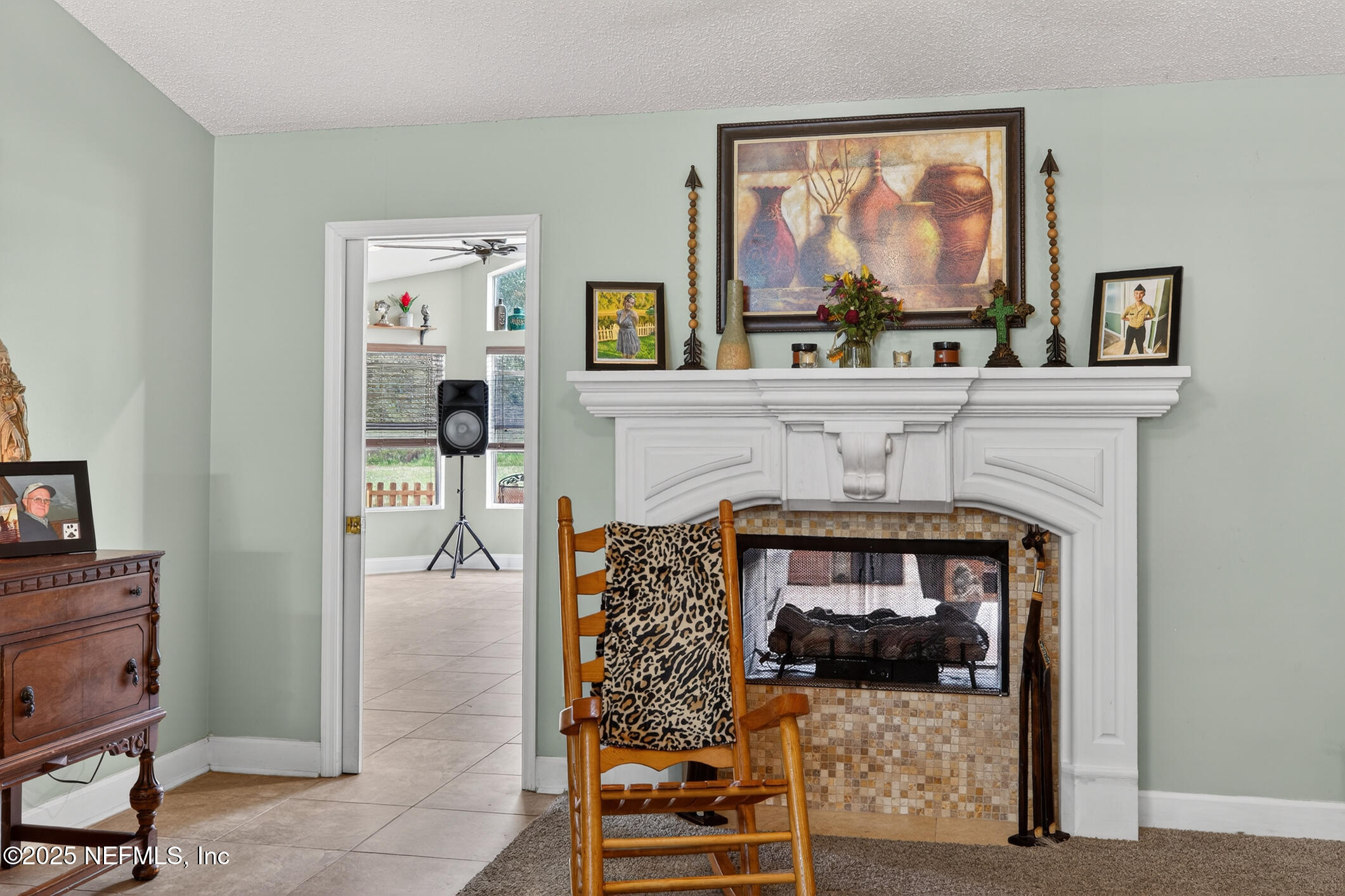 701 Camp Francis Johnson Road Orange Park, FL 32065 - Photo 25 of 64 a living room with furniture and a fireplace