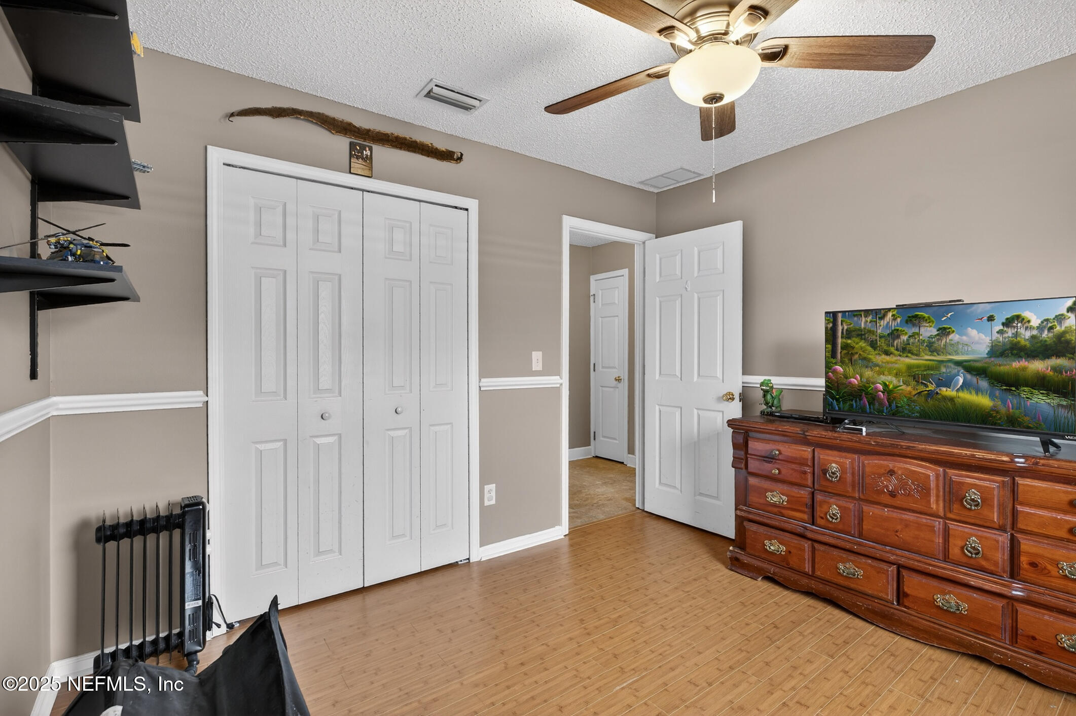 701 Camp Francis Johnson Road Orange Park, FL 32065 - Photo 36 of 64 wooden floor in an empty room with a window
