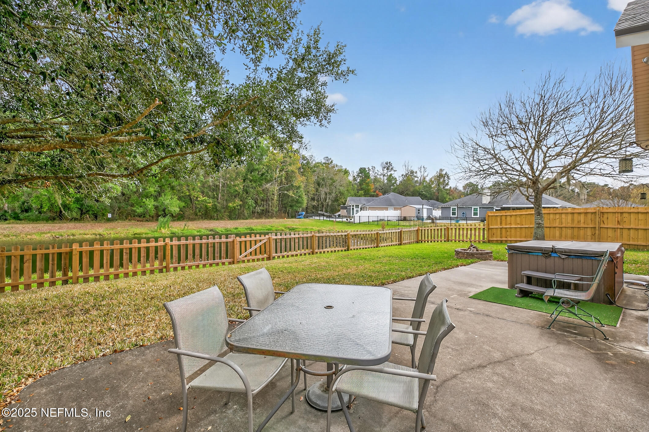 701 Camp Francis Johnson Road Orange Park, FL 32065 - Photo 49 of 64 a view of a chairs and table on the patio
