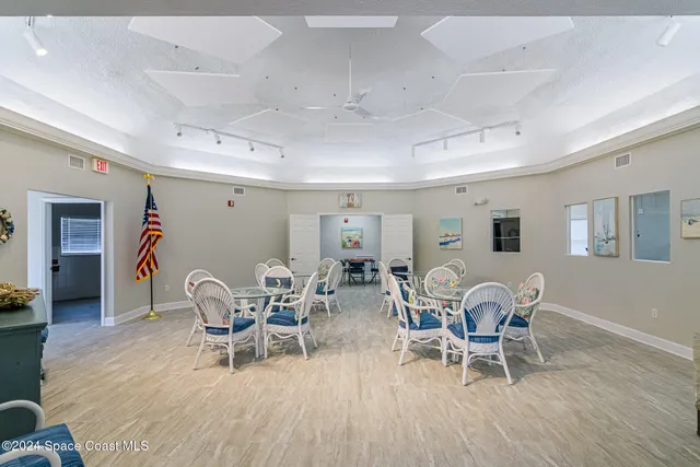 an aerial view of a house with a lake view