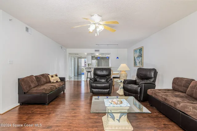 a view of a livingroom with furniture and a flat screen tv
