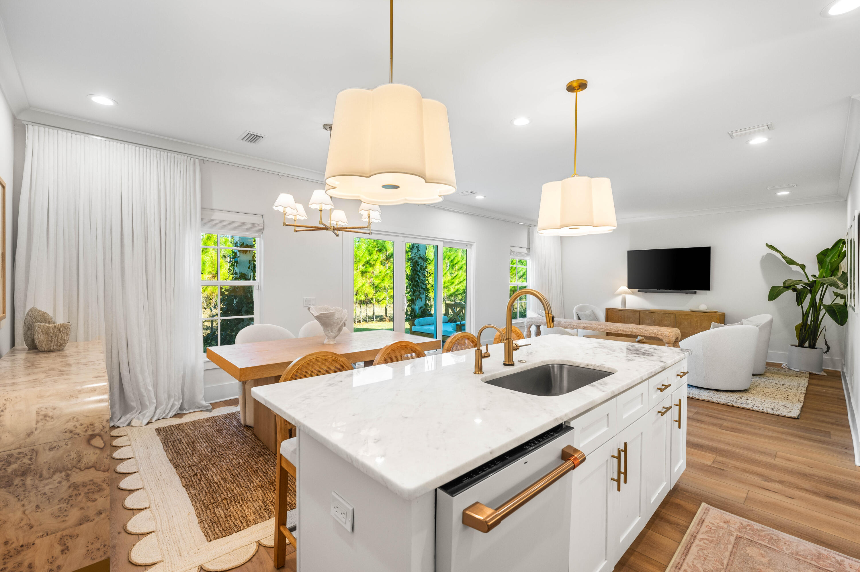 15 Sugar Sands Drive Santa Rosa Beach, FL 32459 - Photo 11 of 46 a kitchen with stainless steel appliances granite countertop a sink a stove and a wooden floor
