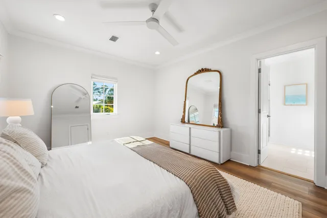 a bedroom with bed and window