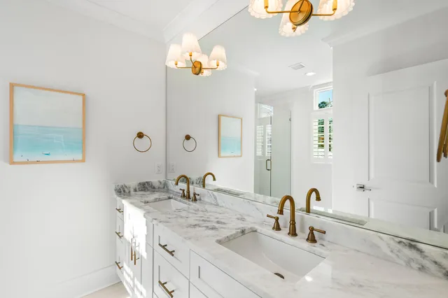 a bathroom with a double vanity sink and a mirror