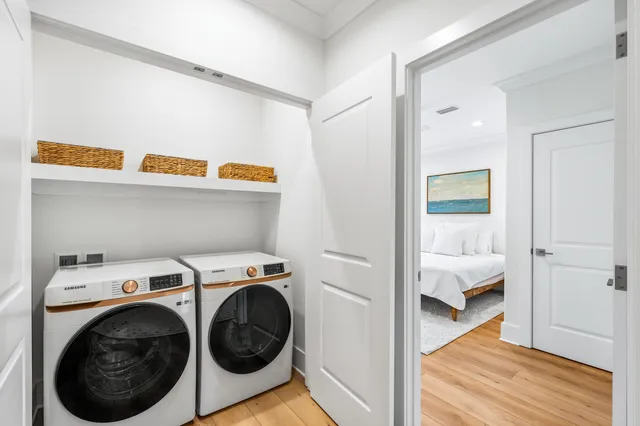 a view of storage and utility room with washer and dryer