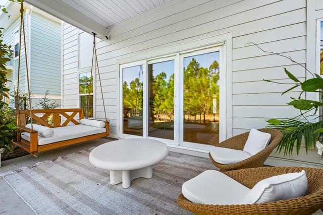 a outdoor living space with furniture and a large window