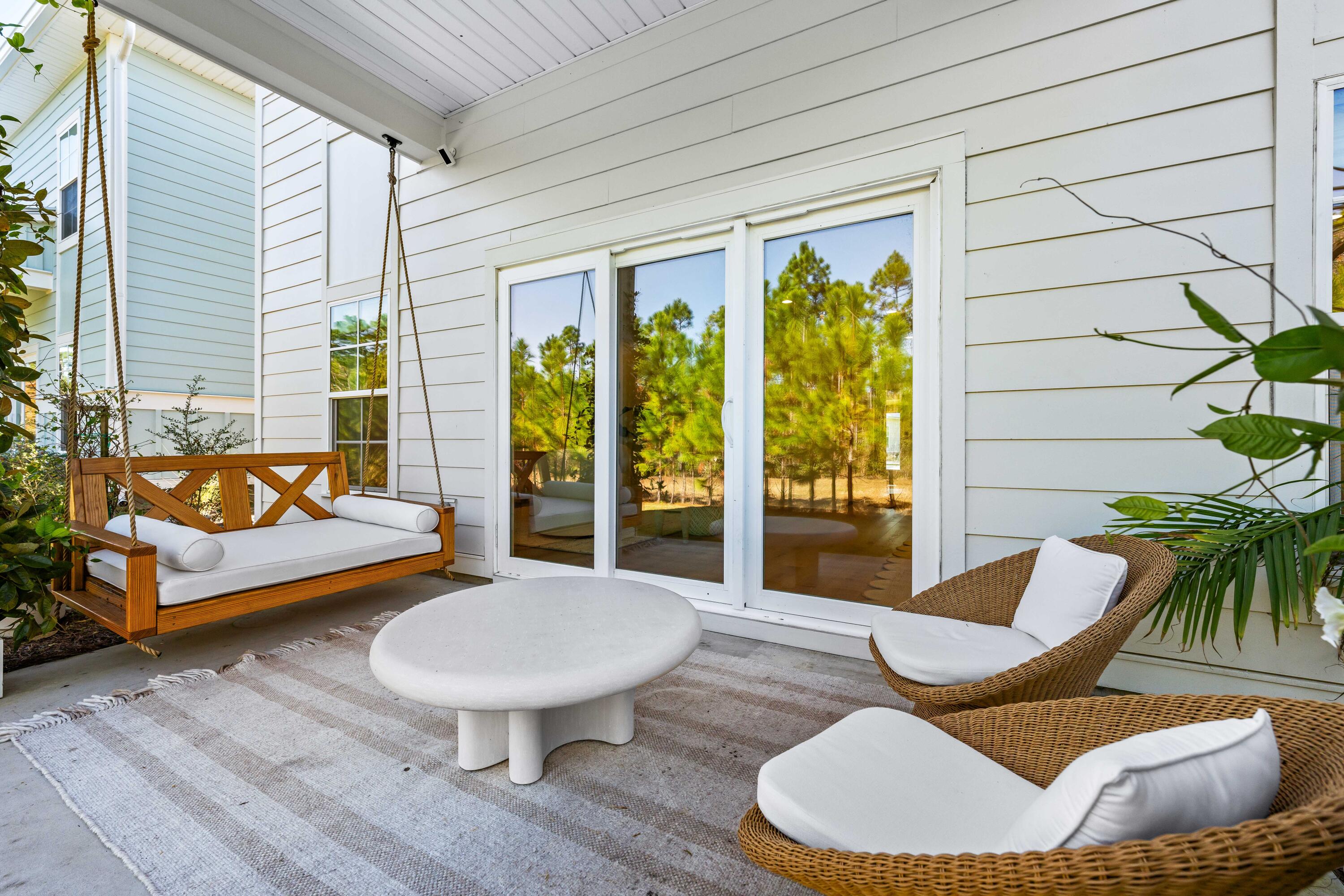 15 Sugar Sands Drive Santa Rosa Beach, FL 32459 - Photo 31 of 46 a outdoor living space with furniture and a large window