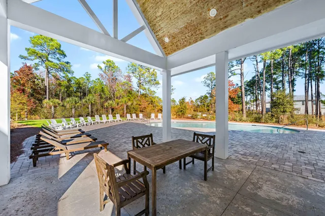 a view of an outdoor sitting area with furniture