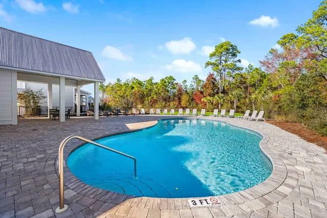 a view of a swimming pool with a patio