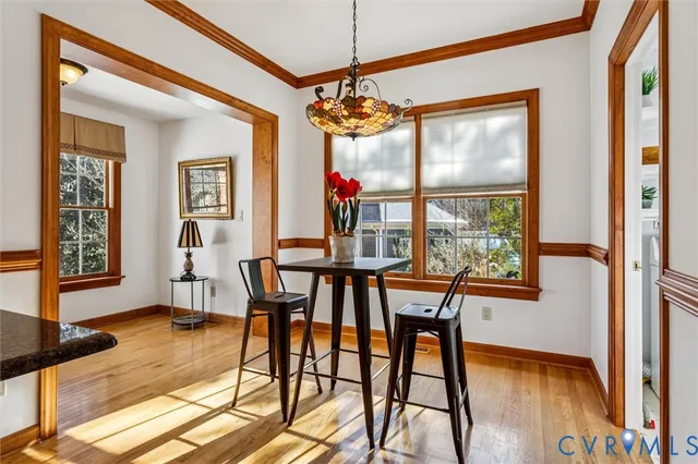 a dining room with furniture and window