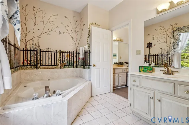 a bathroom with a bathtub and a sink