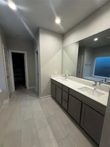 a bathroom with a bath tub and shower