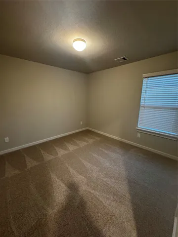 an empty room with an empty space and a window