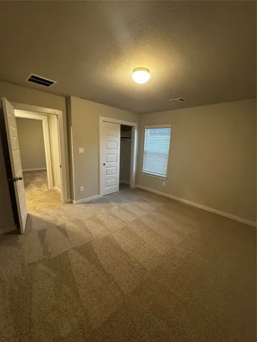 a sign board with a building in the background