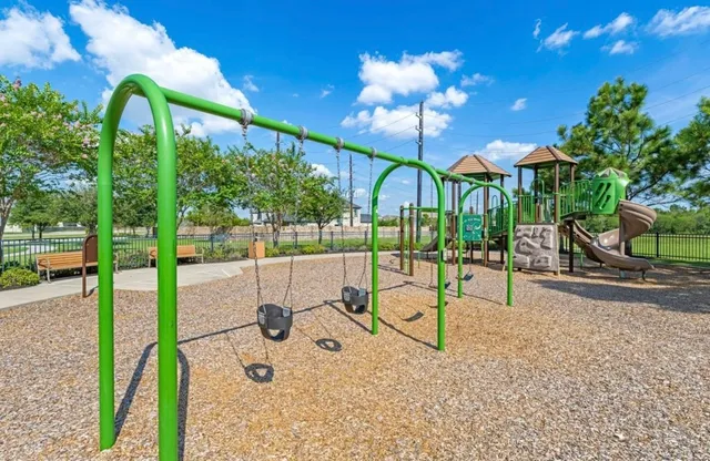 a view of two chairs in a balcony