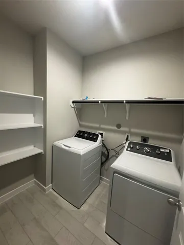 a large kitchen with kitchen island a sink counter space and a center island