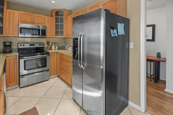 a room with a washing machine and a shower curtain