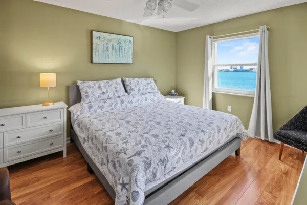 a bedroom with a bed and a dresser