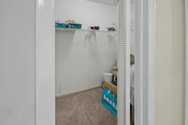 a bathroom with a toilet and shower