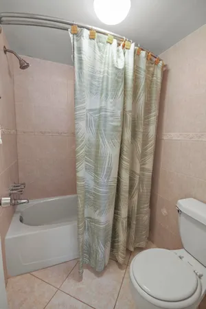 a bedroom with a bed and flat screen tv