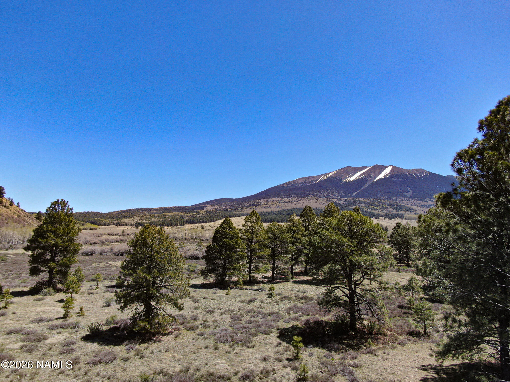 3 Hart Prairie Road Flagstaff, AZ 86001 - Photo 11 of 30 a view of a mountain with a mountain in the background