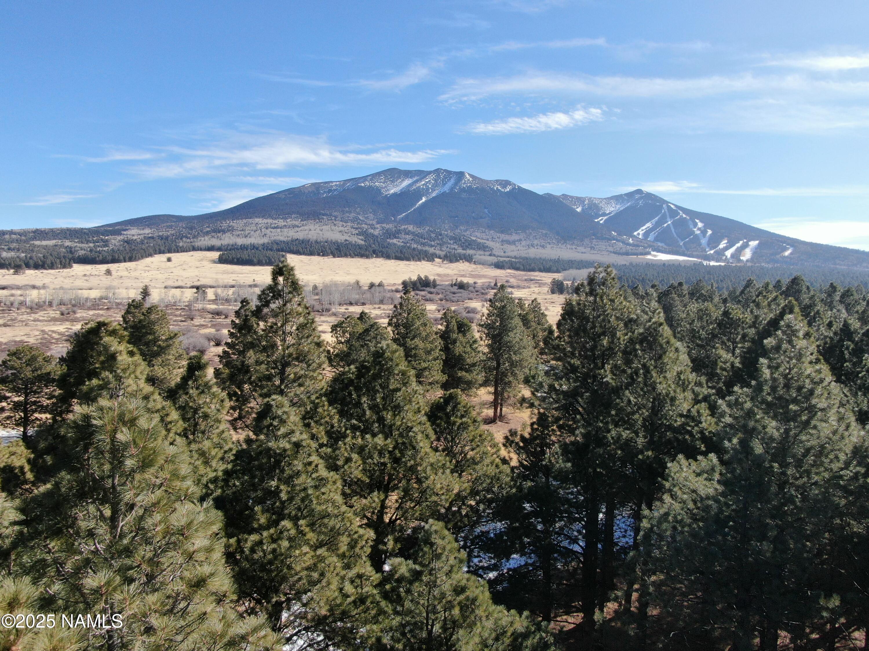 3 Hart Prairie Road Flagstaff, AZ 86001 - Photo 24 of 30 a view of mountain with sunset in background