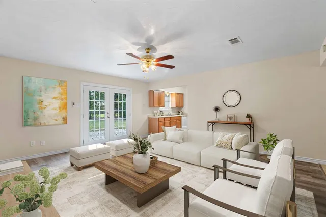 a living room with furniture and a large window