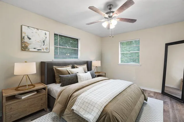 a bedroom with a bed and a lamp