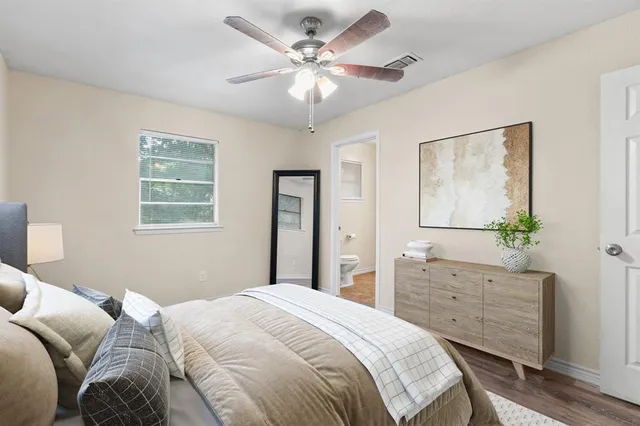 a bedroom with a bed and a dresser