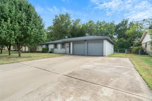 a house with trees in the background