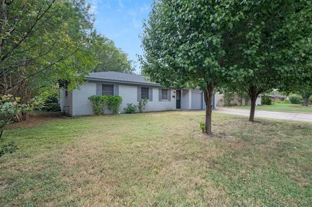 a house with trees in front of it