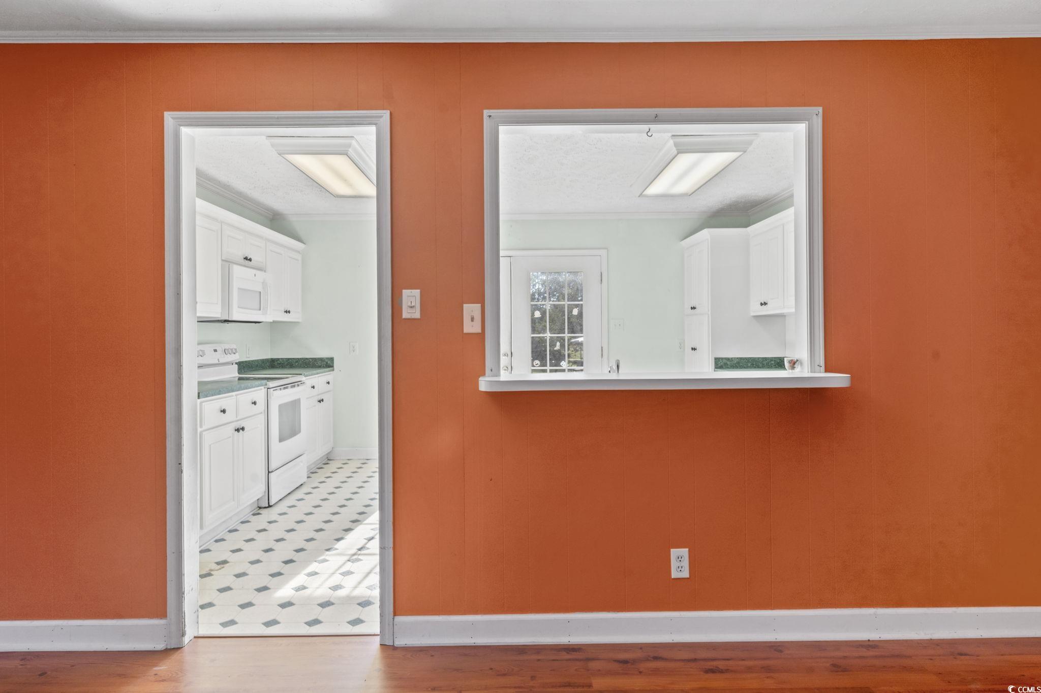 6971 Alfred Road Aynor, SC 29511 - Photo 12 of 37 Empty room with ornamental molding and light wood-style flooring